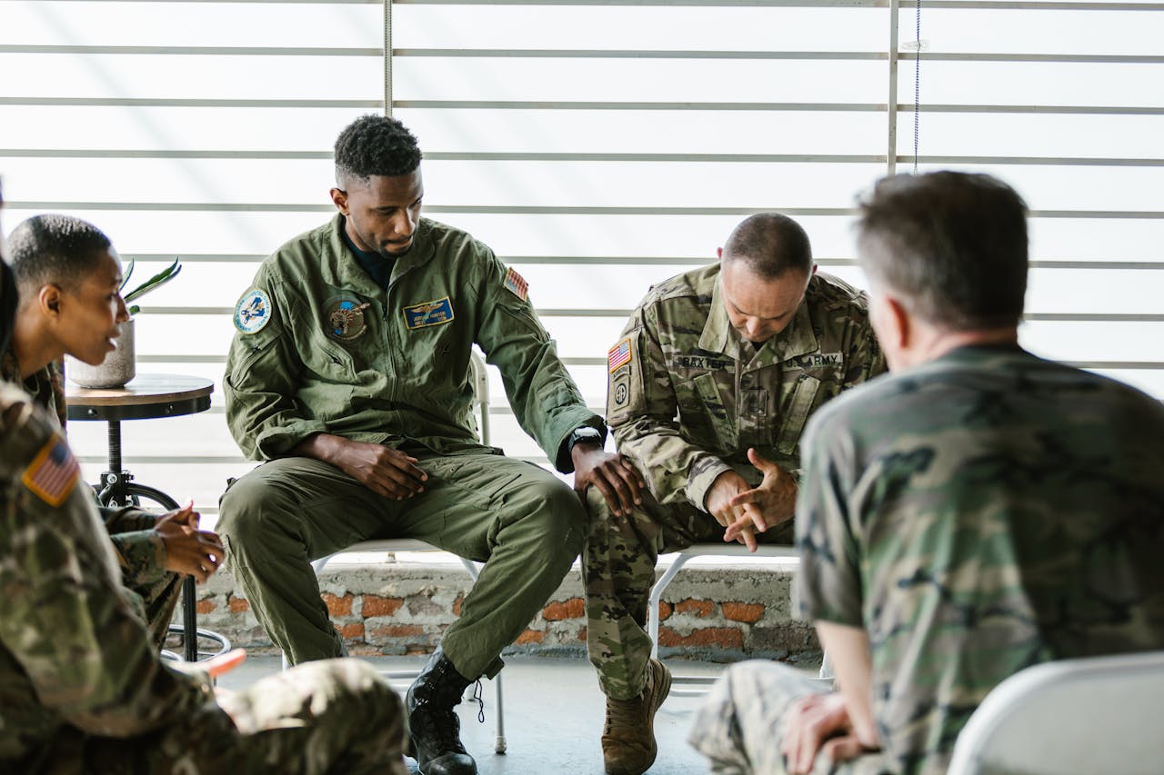Soldiers in a supportive group therapy session focusing on mental health and recovery.